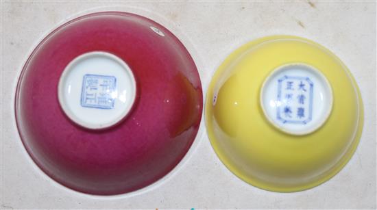 A Chinese ruby ground bowl and a similar yellow ground cup, Yongzheng marks, probably Republic period, diameter 9cm and 7.7cm, hairline